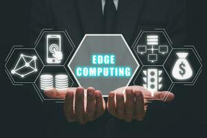 Edge computing modern IT technology concept, Businessman hand holding edge computing icon on virtual screen, Business, technology, internet and networking photo