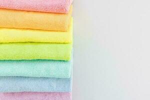 New microfiber cloth for cleaning and dusting. Seven rainbow colors. Top view, closeup photo