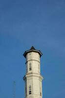 Purwakarta, 05 May 2023 - View of the minaret of the Tajug Gede Cilodong Mosque against a blue sky as a background, located in Cilodong, Purwakarta photo