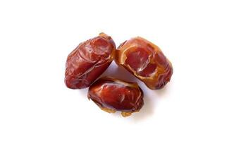 Pile of tasty dry dates isolated on white background. Kurma, buah kurma, Arabic food. photo