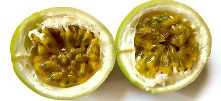 Yellow passion fruit with cut in half isolated on white background. photo