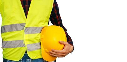 Construction worker holding yellow helmet. Building worker wearing fluorescent waistcoat. Isolated. photo