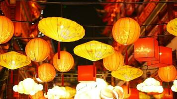 The colorful Chinese lantern hanging up during the festival days for the good blessing photo