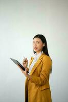 Portrait photo of young beautiful Asian woman feeling happy and holding smart phone, tablet and laptop with black empty screen on white background product presenting concept.