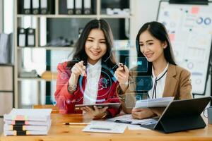 Two Woman using chat bot in smartphone intelligence Ai. Chat with AI Artificial Intelligence, developed by OpenAI generate. robot in online system. in office photo