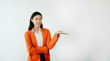 Portrait photo of young beautiful Asian woman feeling happy and holding smart phone, tablet and laptop with black empty screen on white background product presenting concept.