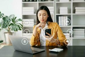 Woman Hand using tablet ,laptop, and holding mobile phone with credit card online banking payment communication network, internet application virtual icon photo