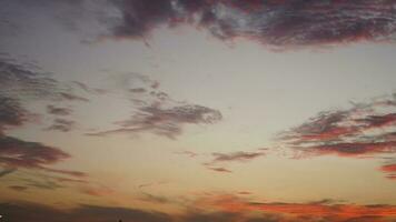 The beautiful sunset view with the buildings' silhouette and orange color sky as background in the city photo