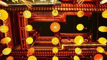 The colorful Chinese lantern hanging up during the festival days for the good blessing photo