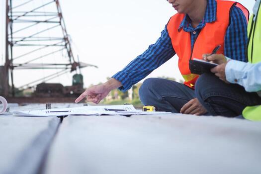 inspector or engineer is inspecting construction and quality assurance new house using a checklist. Engineers or architects or contactor work to build the house before handing it over to the homeowner photo