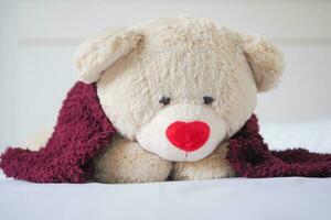 Teddy bear sick with a headache, seasonal influenza, allergic, high fever and influenza, resting, virus, coronavirus, feel illness, respiratory, cold and flu, exhaustion, infection, unwell photo