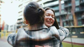 Two happy women hug each other when meeting after long separation. video