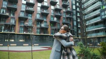 Two happy women hug each other when meeting after long separation. video