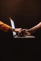 Photo Shot of Casual or Friendly Handshake Through Laptop for Virtual Meeting.