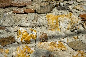 Ancient medieval stone wall texture background. photo