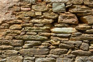 Ancient medieval stone wall texture background. photo