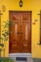 The front door is brown wood, in the old style. photo