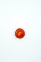 Ripe tomato isolated on white background in close-up photo