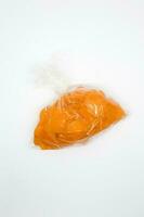 raw crackers in plastic isolated on white background photo