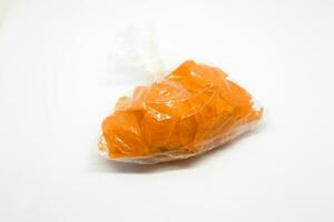 raw crackers in plastic isolated on white background photo