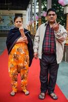 New Delhi, India - March 04 2023 - Unidentified people showing their ink-marked fingers after casting votes in front of polling booth of east Delhi area for MCD local body Elections 2022 photo