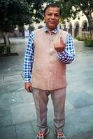 New Delhi, India - May 04 2023 - Unidentified people showing their ink-marked fingers after casting votes in front of polling booth of east Delhi area for MCD local body Elections 2022 photo