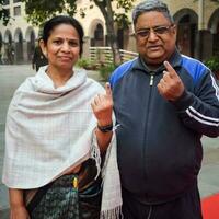 New Delhi, India - May 04 2023 - Unidentified people showing their ink-marked fingers after casting votes in front of polling booth of east Delhi area for MCD local body Elections 2022 photo