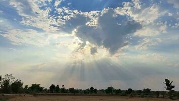 sun during the cloudy sky, and at this time amazing sun Rays come from clouds. photo