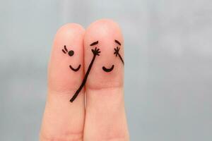 Finger art of a Happy couple. girl closed her eyes to boy. boy guessed who closed his eyes. photo