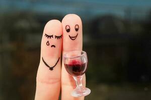 Finger art of couple. Woman is upset because man drunk. photo