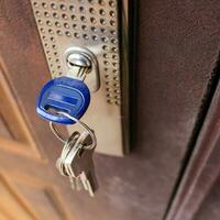 The key in the lock of the iron door. photo