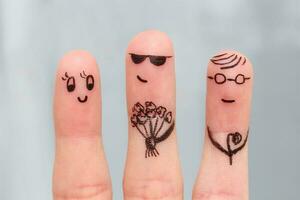 Finger art. Men give flowers to a woman. photo