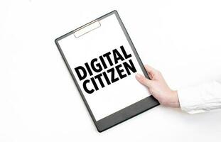 A businessman holds a folder with paper sheet with the text DIGITAL CITIZEN. Business concept. photo