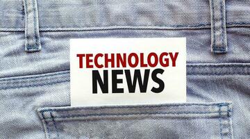 Text technology news on a white paper stuck out from jeans pocket. Business concept photo