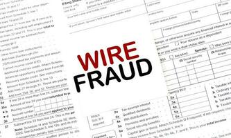 WIRE FRAUD of the box on white sticker and documents photo