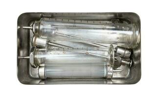 glass syringes in steel syringe boil container photo