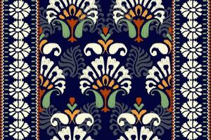 ikat floral cachemir bordado en oscuro púrpura fondo.ikat étnico oriental modelo tradicional.azteca estilo resumen vector ilustración.diseño para textura,tela,ropa,envoltura,decoración,alfombra