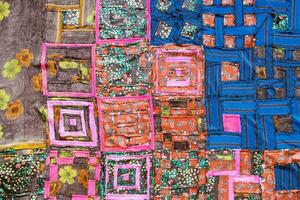 rear view of handcrafted motley patchwork cloth photo