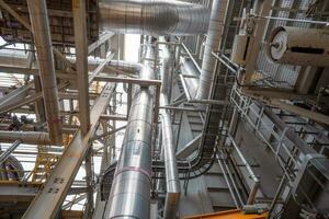 Heat recovery Steam Generator with pipe line, air intake and Up stair. The photo is suitable to use for industry background photography, power plant poster and electricity content media.