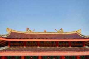 Chinese temple with guardian statue when Chinese new year celebration. The photo is suitable to use for Chinese new year, lunar new year background and content media.