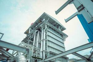 Heat recovery Steam Generator with pipe line, air intake and Up stair. The photo is suitable to use for industry background photography, power plant poster and electricity content media.