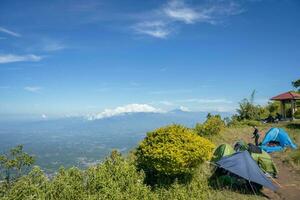 Aerial view from peak of domestic mountain Central Java Semarang. The photo is suitable to use for adventure content media, nature poster and forest background.