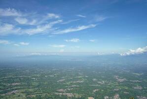 Aerial view from peak of domestic mountain Central Java Semarang. The photo is suitable to use for adventure content media, nature poster and forest background.