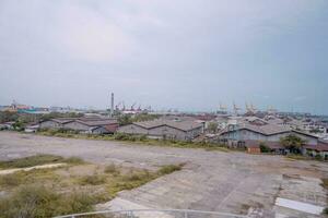 Arial view of power plant project with blue sky and cloudy vibes. The photo is suitable to use for industry background photography, power plant poster and electricity content media.