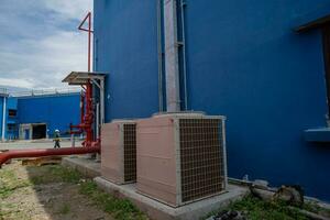 Array of outdoor fan air conditioner on the roof top building. The photo is suitable to use for construction and maintenance of air conditioner.