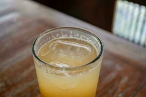 Traditional drink of Indonesia Jamu Beras Kencur Iced, fresh and tasty. The photo is suitable to use for drink background, menu poster and content media.