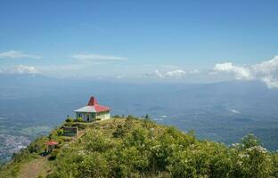 Aerial view from peak of domestic mountain Central Java Semarang. The photo is suitable to use for adventure content media, nature poster and forest background.