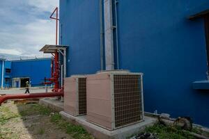 Array of outdoor fan air conditioner on the roof top building. The photo is suitable to use for construction and maintenance of air conditioner.