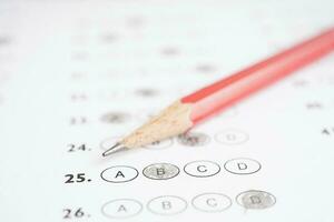 Answer sheets with pencil drawing fill to select choice, education concept. photo