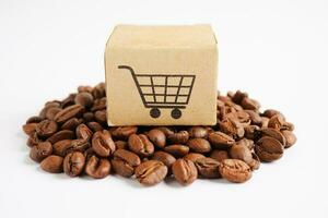 Shopping cart box on coffee beans, shopping online for export or import. photo